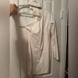 Fashion Nova white one-shoulder top with a relaxed fit